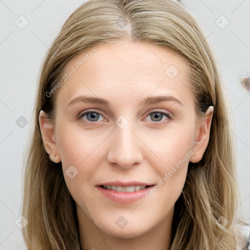 Joyful white young-adult female with long  brown hair and blue eyes