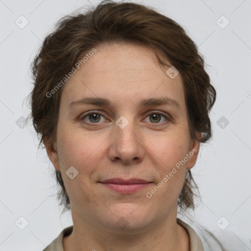 Joyful white adult female with short  brown hair and grey eyes