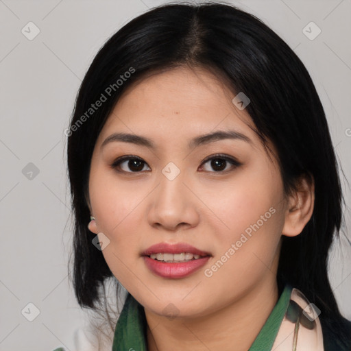 Joyful asian young-adult female with medium  black hair and brown eyes