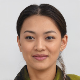 Joyful asian young-adult female with medium  brown hair and brown eyes