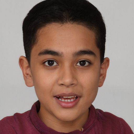 Joyful latino child male with short  brown hair and brown eyes