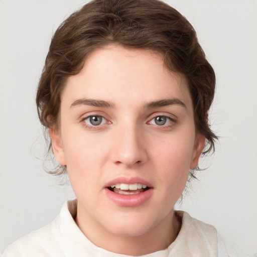 Joyful white young-adult female with medium  brown hair and green eyes