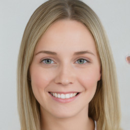 Joyful white young-adult female with long  brown hair and blue eyes