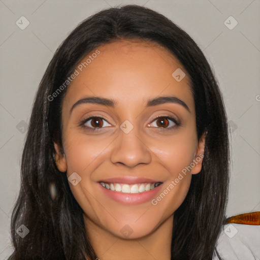 Joyful latino young-adult female with long  black hair and brown eyes