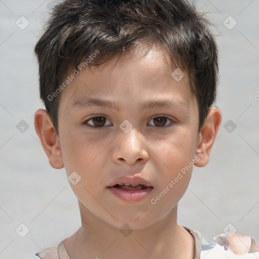 Joyful white child male with short  brown hair and brown eyes