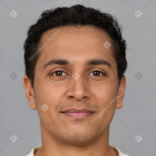 Joyful latino young-adult male with short  brown hair and brown eyes