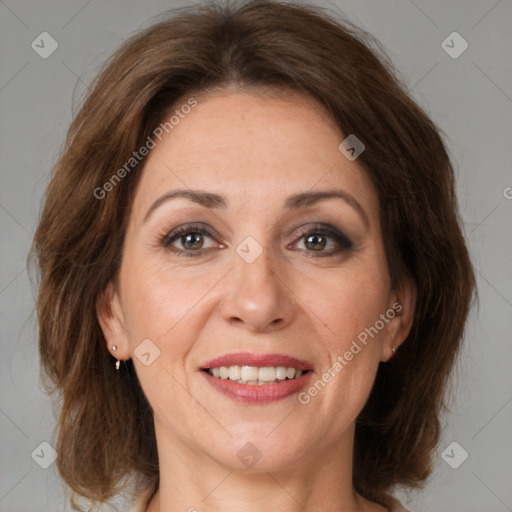 Joyful white adult female with medium  brown hair and brown eyes