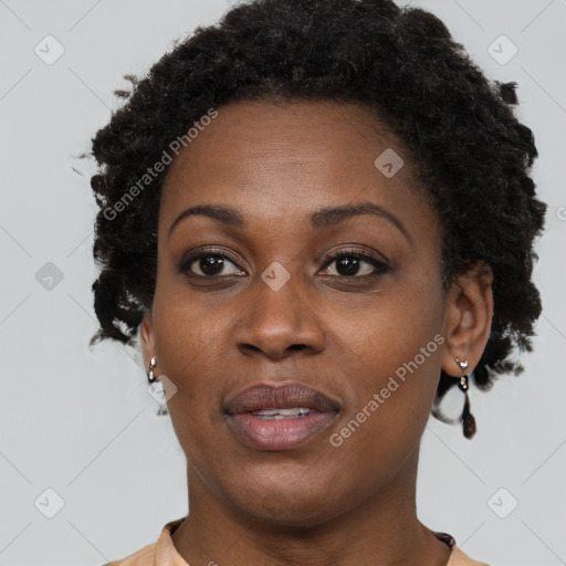 Joyful black adult female with short  brown hair and brown eyes