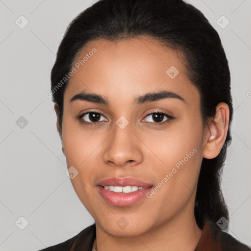 Joyful latino young-adult female with medium  black hair and brown eyes