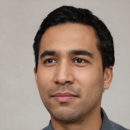 Neutral latino young-adult male with short  black hair and brown eyes