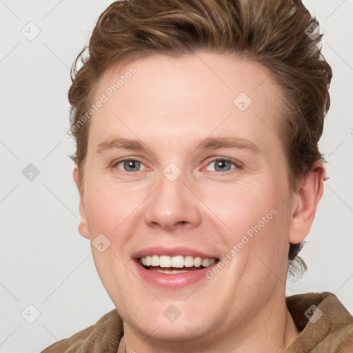 Joyful white young-adult female with short  brown hair and blue eyes