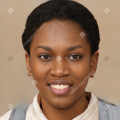 Joyful black young-adult female with short  black hair and brown eyes