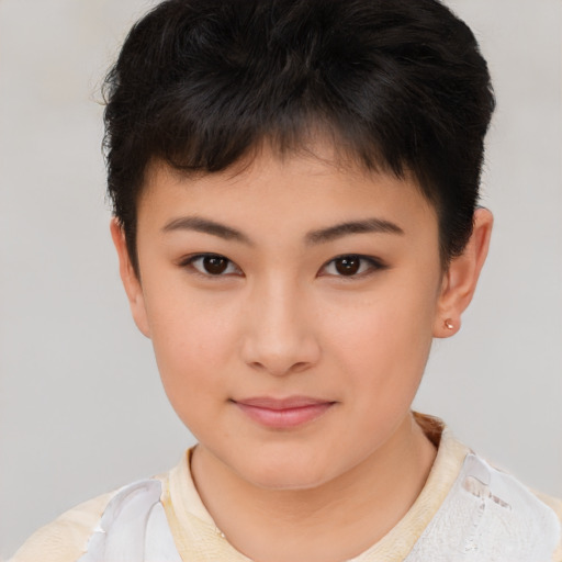 Joyful asian child female with short  brown hair and brown eyes