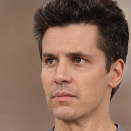 Neutral white adult male with short  brown hair and brown eyes
