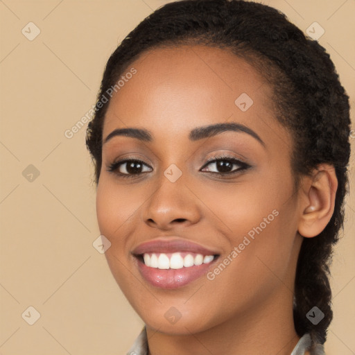 Joyful latino young-adult female with long  brown hair and brown eyes