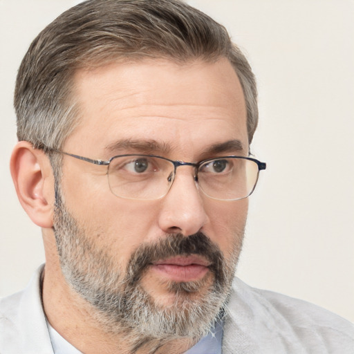 Neutral white adult male with short  gray hair and brown eyes