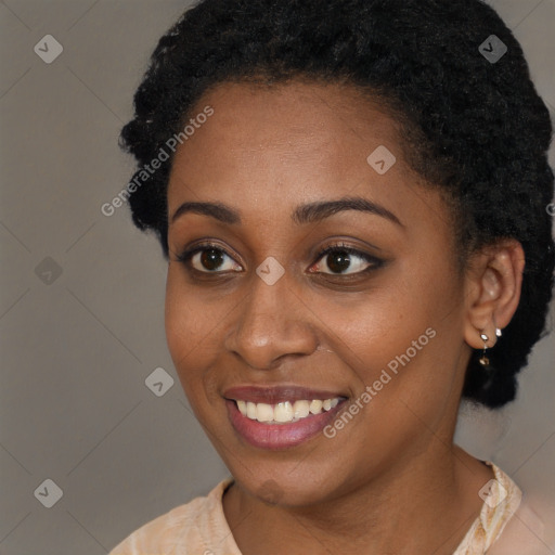 Joyful black young-adult female with short  brown hair and brown eyes