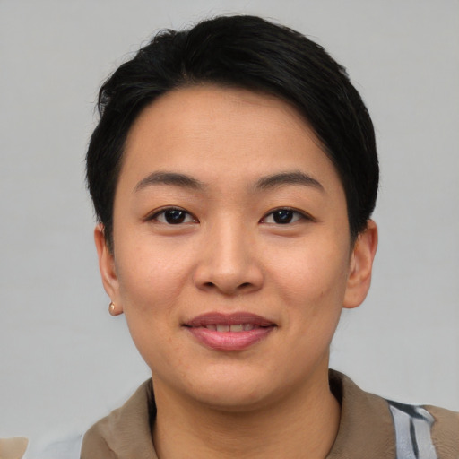 Joyful asian young-adult female with short  black hair and brown eyes