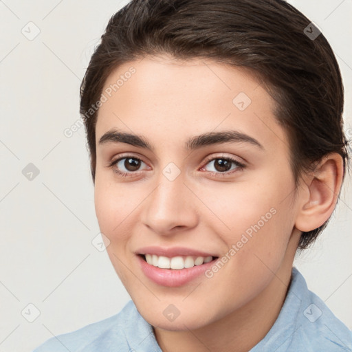 Joyful white young-adult female with medium  brown hair and brown eyes