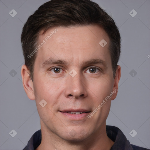 Joyful white adult male with short  brown hair and brown eyes