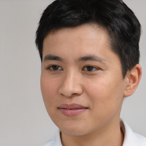 Joyful white young-adult male with short  black hair and brown eyes