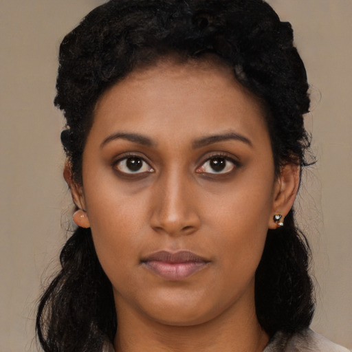 Neutral black young-adult female with long  black hair and brown eyes