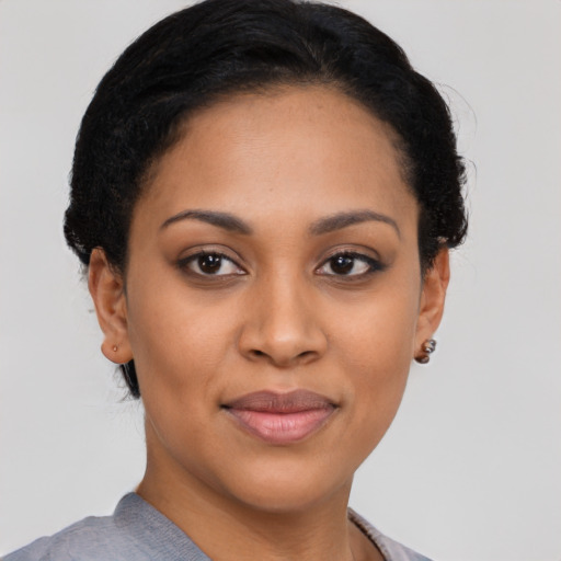 Joyful asian young-adult female with short  black hair and brown eyes