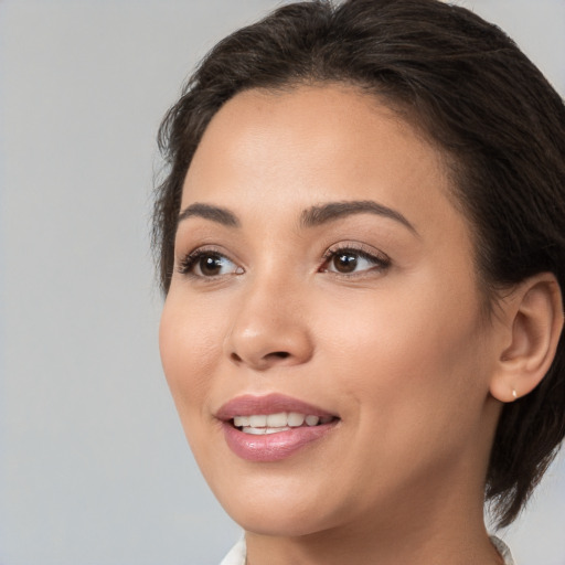 Joyful white young-adult female with medium  brown hair and brown eyes