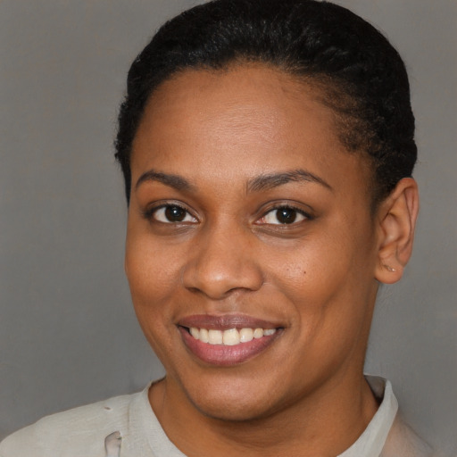 Joyful latino young-adult female with short  brown hair and brown eyes