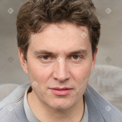 Joyful white adult male with short  brown hair and grey eyes