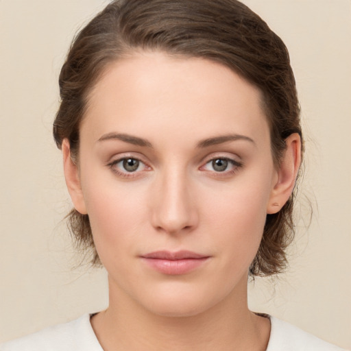 Neutral white young-adult female with medium  brown hair and brown eyes