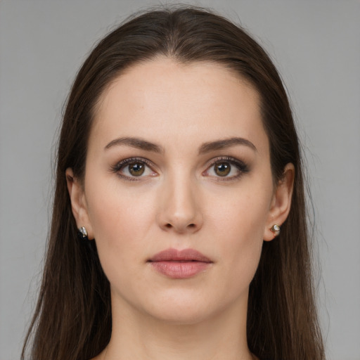 Neutral white young-adult female with long  brown hair and brown eyes