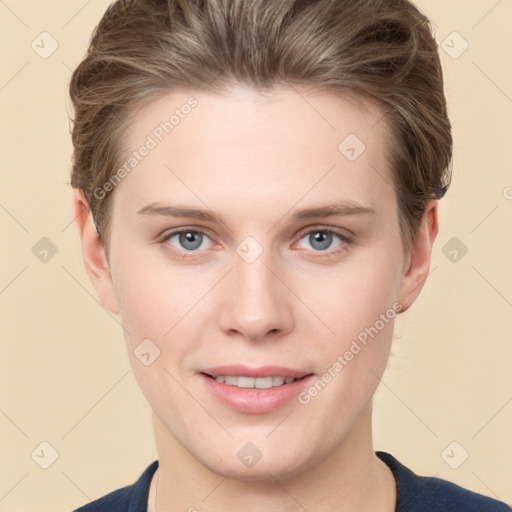 Joyful white young-adult female with short  brown hair and grey eyes