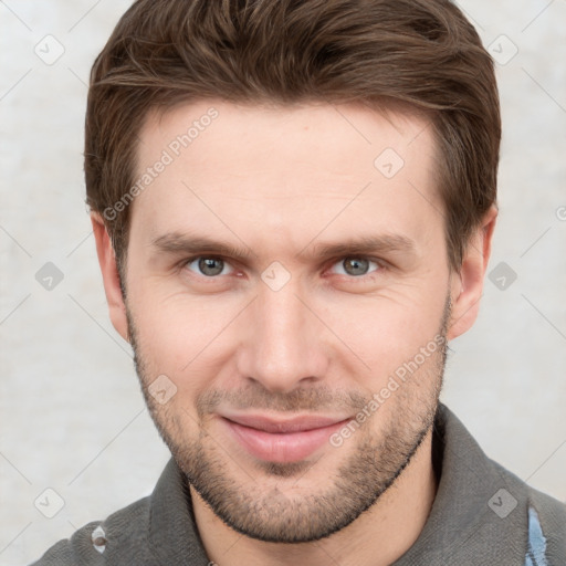 Joyful white young-adult male with short  brown hair and grey eyes