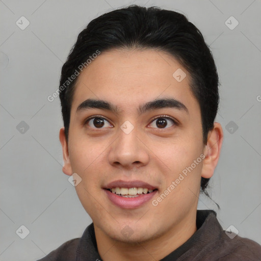 Joyful asian young-adult male with short  brown hair and brown eyes