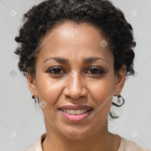 Joyful black adult female with short  brown hair and brown eyes