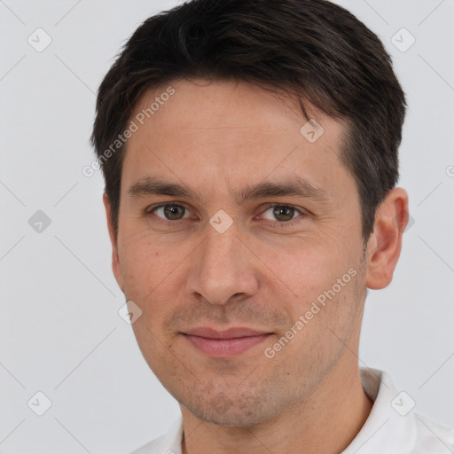 Joyful white adult male with short  brown hair and brown eyes