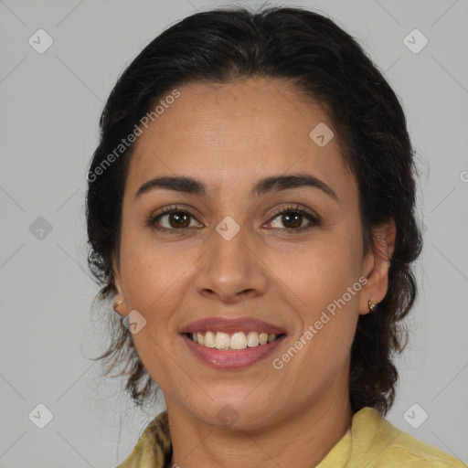 Joyful latino adult female with medium  brown hair and brown eyes