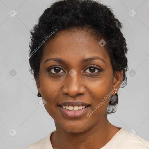 Joyful black young-adult female with short  black hair and brown eyes