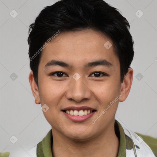Joyful asian young-adult male with short  black hair and brown eyes
