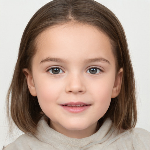 Joyful white child female with medium  brown hair and grey eyes