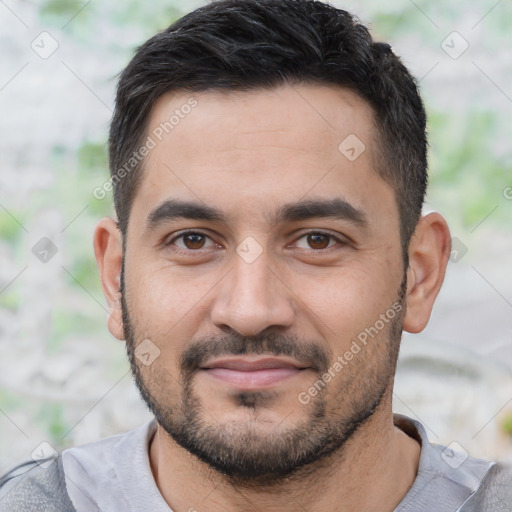 Joyful asian young-adult male with short  black hair and brown eyes