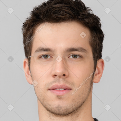 Neutral white young-adult male with short  brown hair and brown eyes