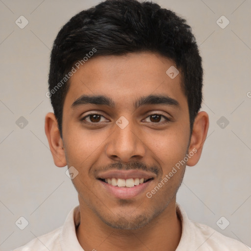 Joyful latino young-adult male with short  brown hair and brown eyes