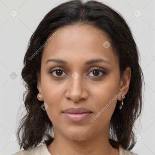 Joyful latino young-adult female with medium  brown hair and brown eyes