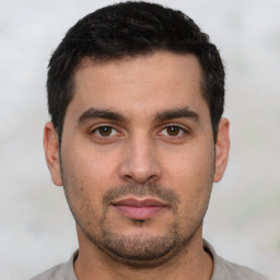 Neutral white young-adult male with short  black hair and brown eyes