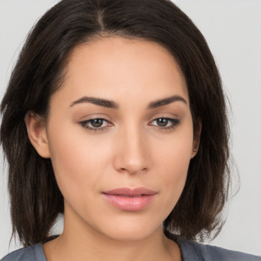 Neutral white young-adult female with medium  brown hair and brown eyes