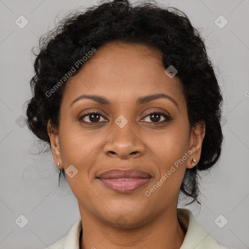 Joyful black adult female with medium  brown hair and brown eyes