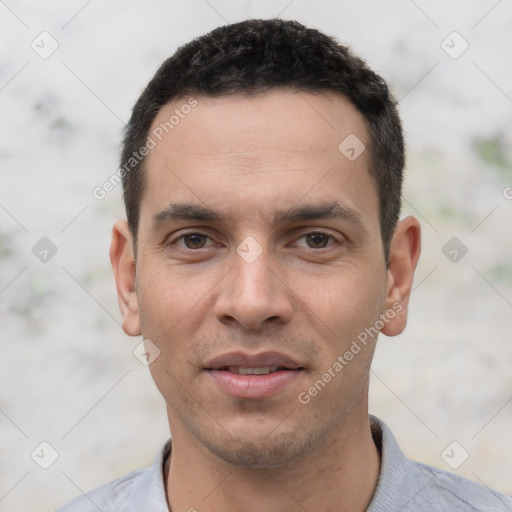 Joyful white young-adult male with short  black hair and brown eyes