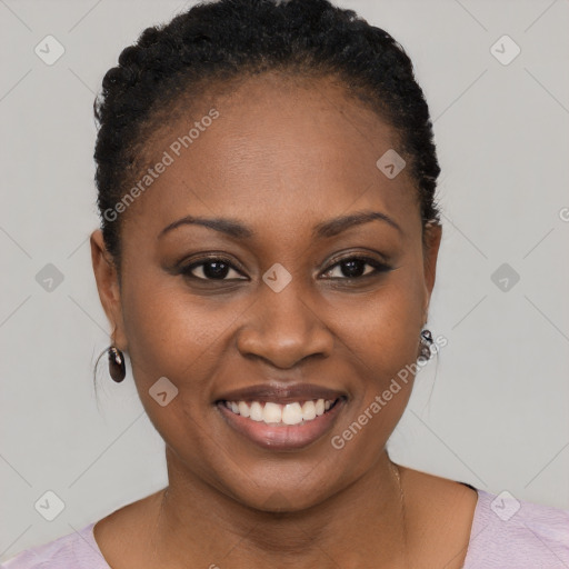 Joyful black young-adult female with short  brown hair and brown eyes